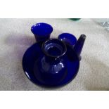 Five pieces of blue glass including hyacinth vase.