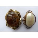 Two 19thc brooches including pinchbeck and onyx.