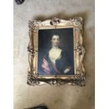 An 18thC portrait of a lady, oil on canvas in original swept gilt frame (bad tear and repair (