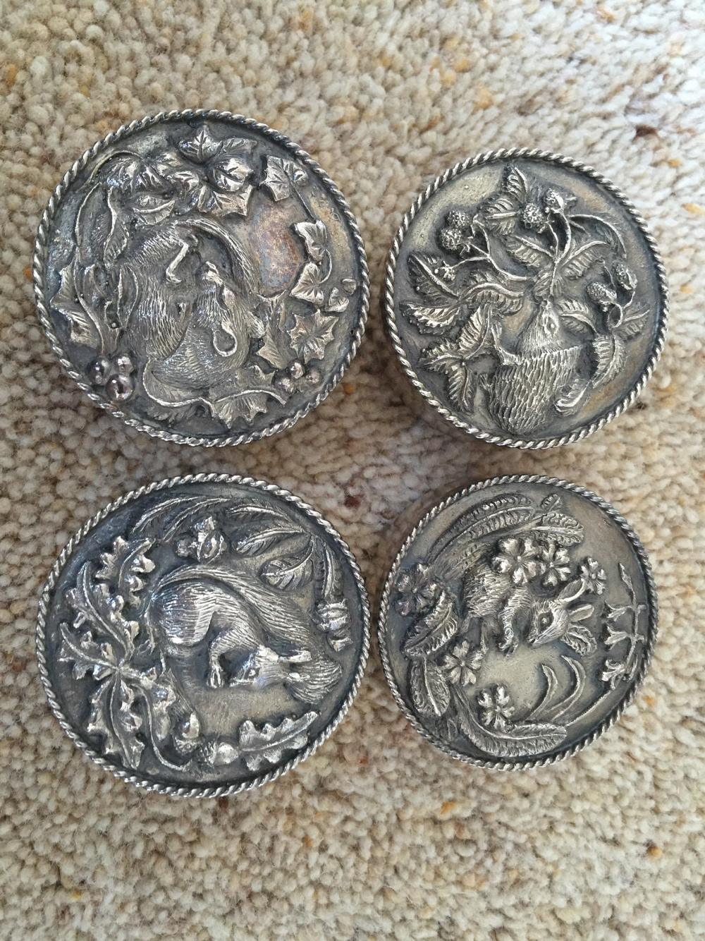 Four silver lidded boxes, 2 Birmingham 1980, 2 Birmingham 1979. 5cms diameter.