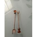 Two sterling silver pickle forks with thistle tops