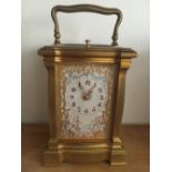 Fine quality 19th century 8 day repeating carriage clock, finely painted cherubic panels, chased and