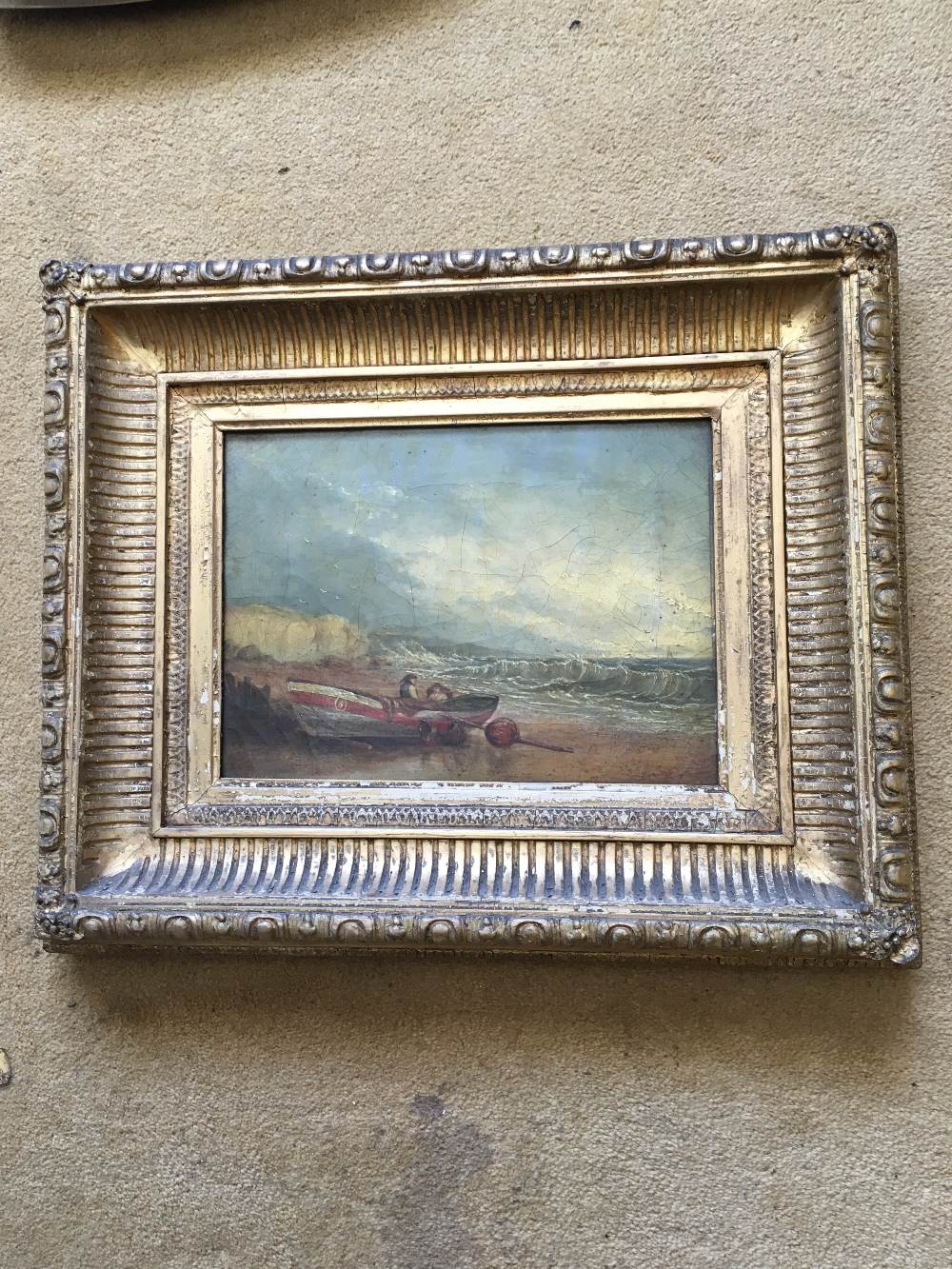 Oil on canvas seascape signed lower left SH Bell 1823-1896 fishing boat and two fishermen beached