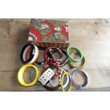 An assortmentof bangles and a wooden Art Deco jewellery box.