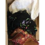 Boxed lot of linen, embroidered shawl etc.