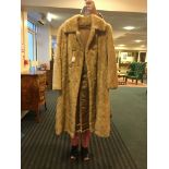 Pale mink tail fur coat, pale patch to one side.