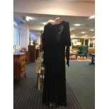 Vintage black dress with diamante detail and a dropped back.