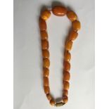 Butterscotch amber bead necklace, 48cms long and approximately 68.9gms.