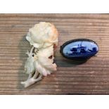 Carved ivory rose brooch and Delft brooch.