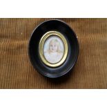 Oval portrait miniature of a young child on ivory HB 1916 4.5cms.