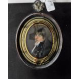 Oval on ivory P M a gentleman in navy blue frock coat in eglomise frame 6cm
