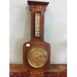 Unusual inlaid mahogany aneroid banjo barometer.