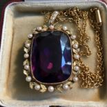 Fifteen carat yellow gold amethyst and seed pearl pendant and chain.