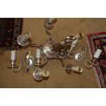 Silver plated five branch chandelier and two matching wall lights with rams head detail.