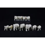 Eleven early 20th century ivory menu holders carved as lions, elephants, camels and other animals