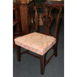 A Chippendale style mahogany dining chair with pierced ribbon splat, pink damask upholstered seat on