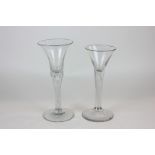 Two 18th century cordial glasses with flared rims and air bubble stems