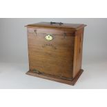 A Victorian stationary box, with fold out writing slope, compartments with photograph frames, and