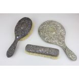 An Edward VIII silver backed dressing table brush, another rectangular brush (a/f) and a silver