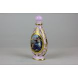 A Vienna porcelain scent bottle with pink ground and gilt embellishment around two oval hand painted