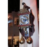 A Dutch 20th century gilt metal mounted wall clock, the finial modelled as Atlas supporting the
