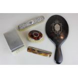 A Victorian tortoiseshell and silver inlaid hand mirror, a Victorian silver mounted tortoiseshell