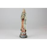 A 19th century carved ivory devotional figure of Madonna and child with worn painted surface, 16cm