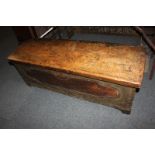 An 18th century continental fruitwood coffer, the domed top with central carved star motif,