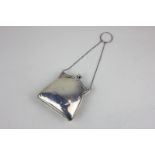 A George V silver purse with green concertina interior and chain handle, maker Jones & Crompton,