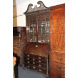 A George III mahogany bureau bookcase, with pierced swan neck surmount (a/f), above glazed panel