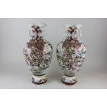 A pair of Japanese Satsuma baluster vases depicting warriors in battle, character marks to base 40cm