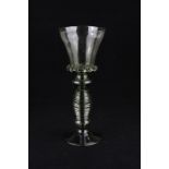 A German green glass Roemer style goblet, with overlaid glass swirl stem, 27cm high