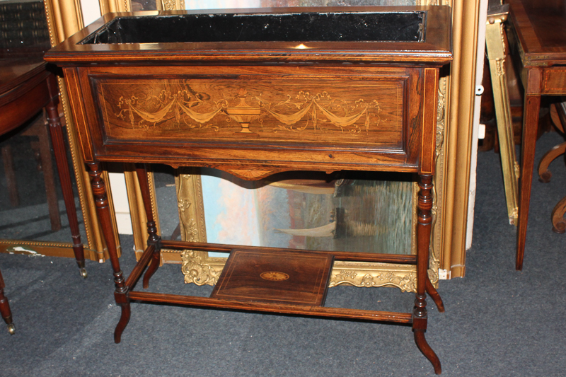 An Edwardian inlaid planter, rectangular form, decorated with swags and urn, on turned supports,