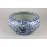A Chinese blue and white circular bowl depicting fish amongst coral with character mark to base 23cm