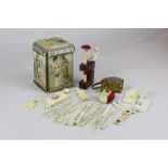 A Victorian sewing box with pin cushion top, another pin cushion, various 19th century ivory and