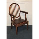 A 19th century slat back carver dining chair with padded arms, on square tapered legs