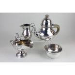 A silver plated three piece tea set with plain bodies, together with a helmet shaped sugar bowl with