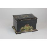 A 19th century black lacquered tea caddy, the scalloped lid with gilt embellishment opening to