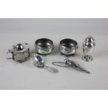 A pair of Victorian silver salts, a George IV silver caddy spoon, a silver mustard (missing liner) a
