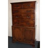 A George III mahogany chest on cabinet, the top section with two short over three long drawers,