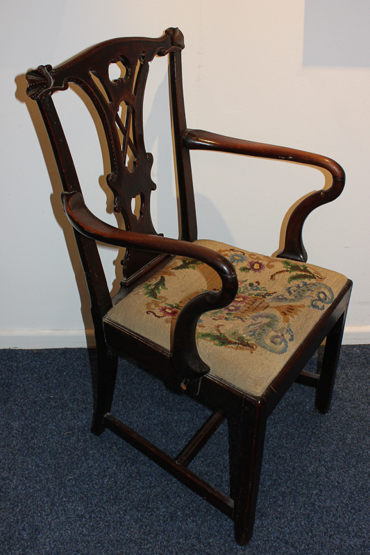 A George III carver dining chair with pierced vase splat, carved fan shaped corners and tapestry