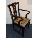 A George III carver dining chair with pierced vase splat, carved fan shaped corners and tapestry