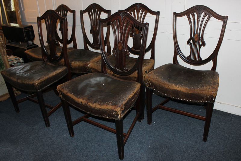 A set of six 19th century mahogany Hepplewhite style dining chairs with inlaid detail on the