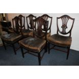 A set of six 19th century mahogany Hepplewhite style dining chairs with inlaid detail on the