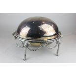 A silver plated oval breakfast dish with revolving domed top on ram's head and swag base with hoof