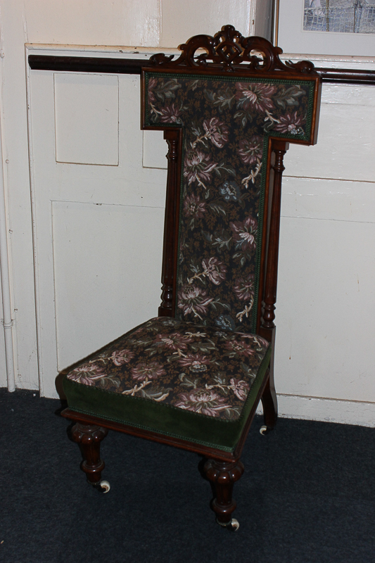 A Victorian prie dieu chair with pierced scroll surmount, tapestry upholstered back and seat