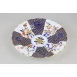 A Royal Worcester porcelain scalloped dish with blue and gilt decoration depicting cherry blossoms
