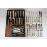 A set of twelve 19th century silver handled and steel blade table knives and twelve dessert