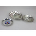A Victorian silver shell shaped dish together with a smaller Edwardian shell shaped dish, maker