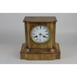 A 19th century French eight day mantel clock by Martin, Paris, with oak case, white enamel dial with